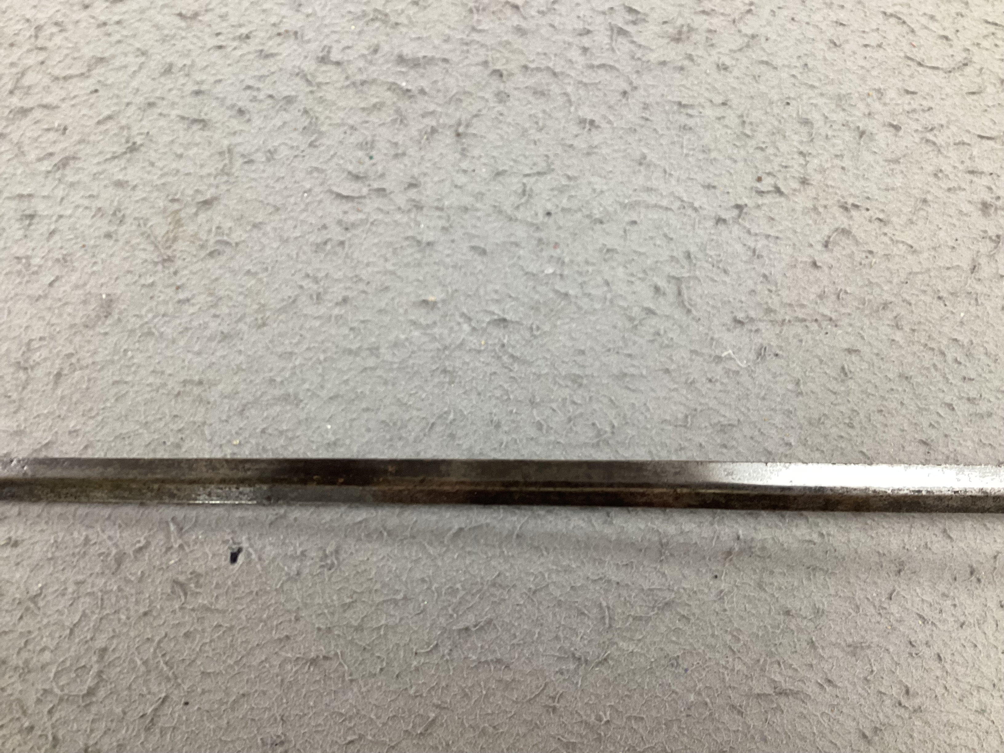 A swept hilt rapier, c.1620, blade fullered at the forte, iron guard of conventional form with later pommel and wooden grip, blade 113cm